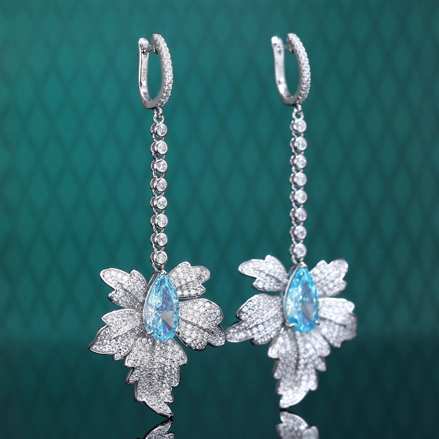 Micro-setting Aquamarine color Lab created stones Maple Leaf earrings, sterling silver.