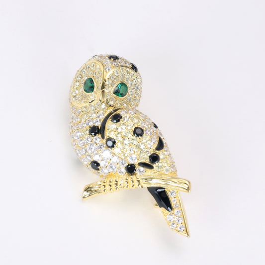 Reservation design Micro-setting the green eyed Owl brooch, sterling silver. yellow gold platting