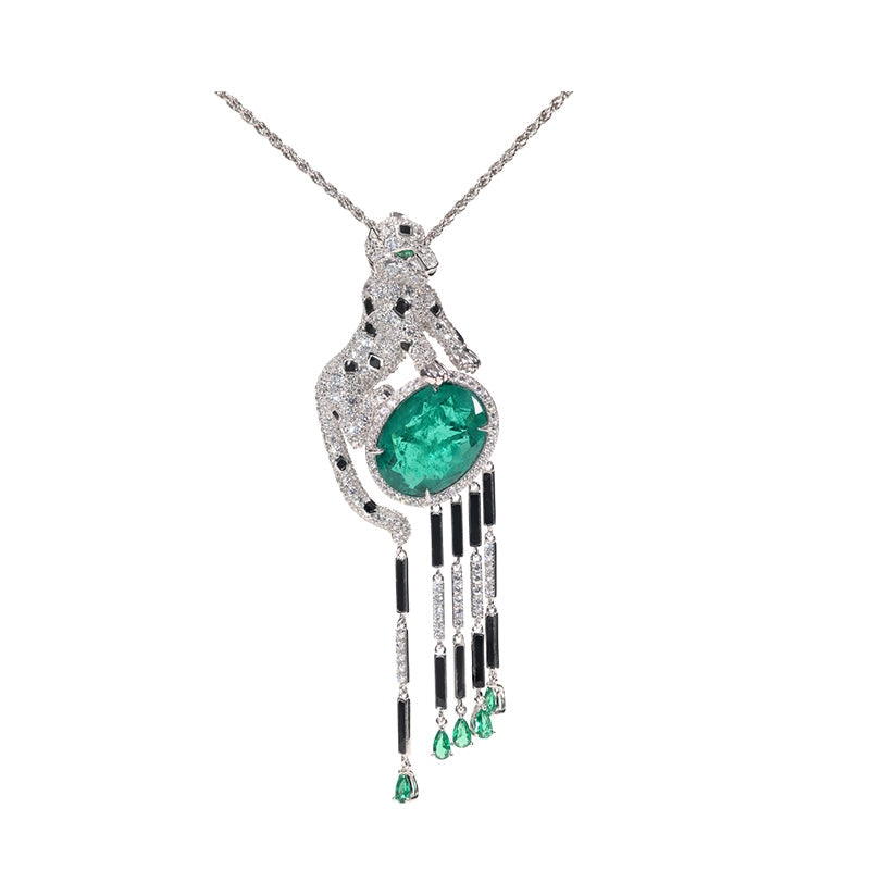 Jaguar selection, featuring stunning artificial emerald and black enamel tassel pendant. sterling silver