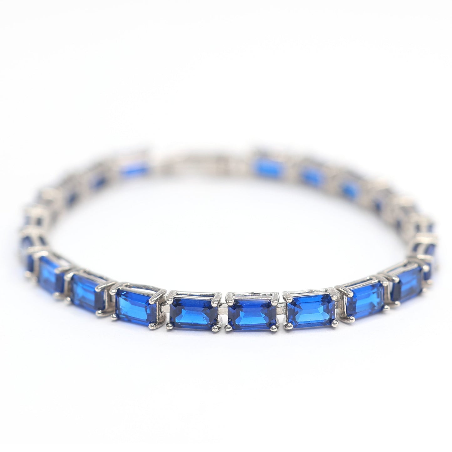 Micro-setting Sapphire color emerald cut Lab created stones fully studded bracelet, sterling silver