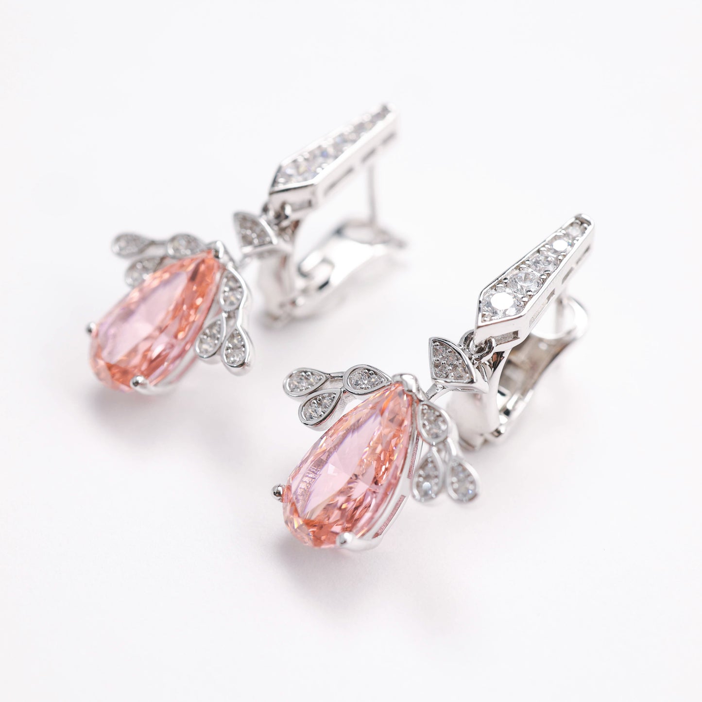 Micro-setting Morganite color Lab created stones Angel's Wings earrings. sterling silver.