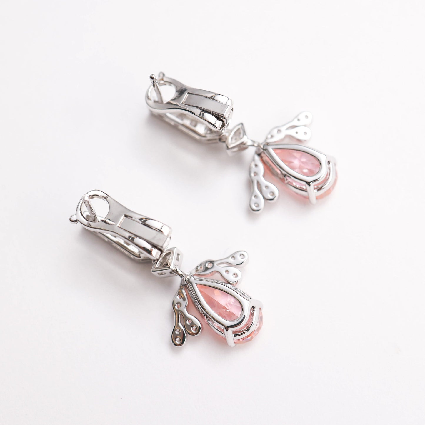 Micro-setting Morganite color Lab created stones Angel's Wings earrings. sterling silver.