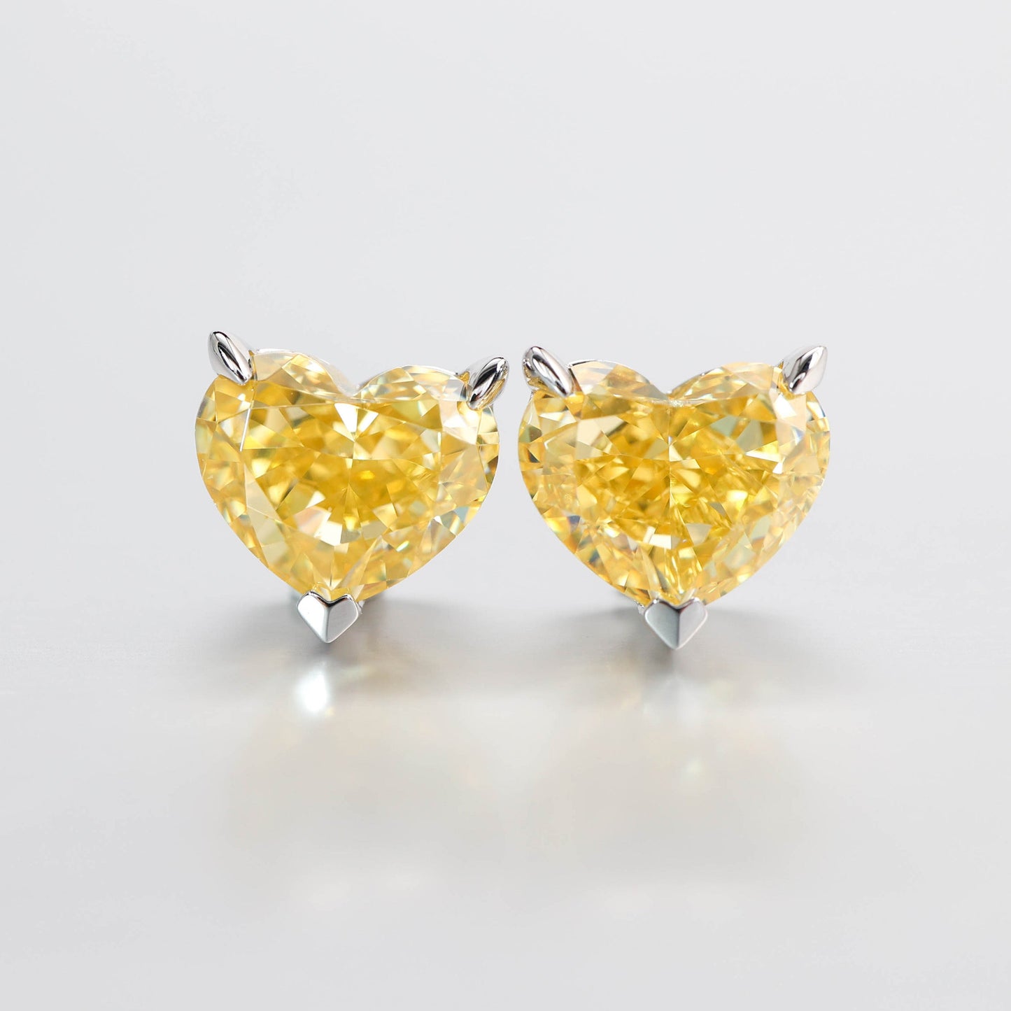 Micro-setting vivid yellow color heart shape earrings. sterling silver