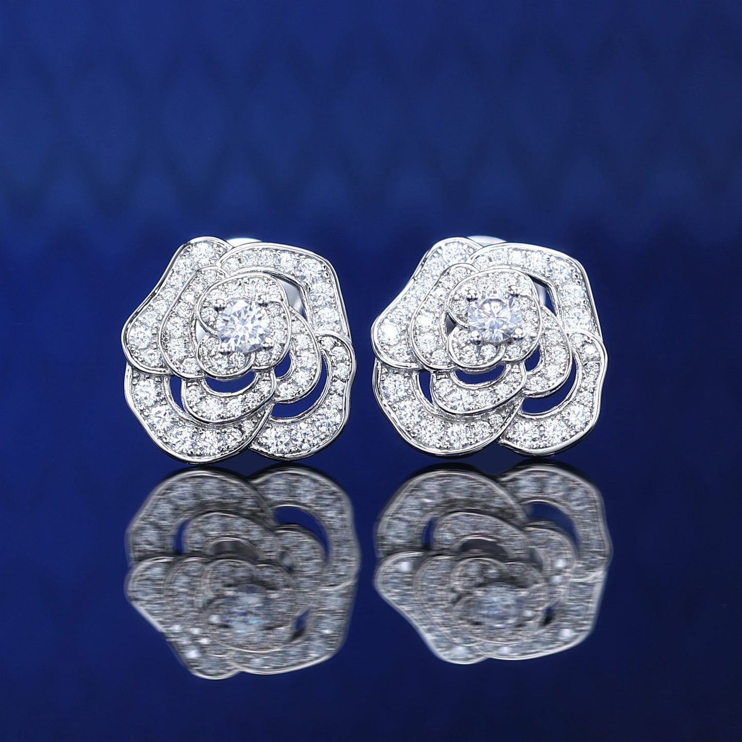 Micro-setting Lab created stones Camellia earrings, sterling silver.