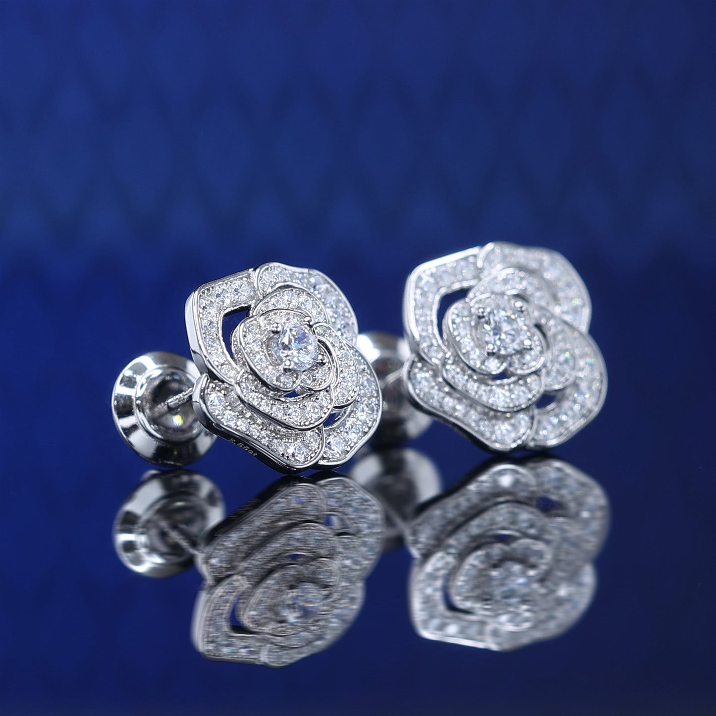 Micro-setting Lab created stones Camellia earrings, sterling silver.